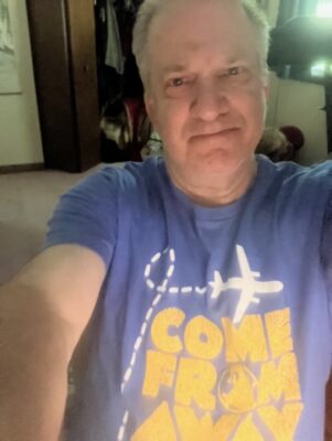 Pianist Jonathan Turner (in a show T-shirt) plays in the live pit for "Come From Away" at Moline's Black Box Theatre.