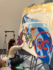 Artist Atlanta Dawn of Silvis painted in the lobby of the Figge Art Museum during the Oct. 28 event to unveil the new QC brand.