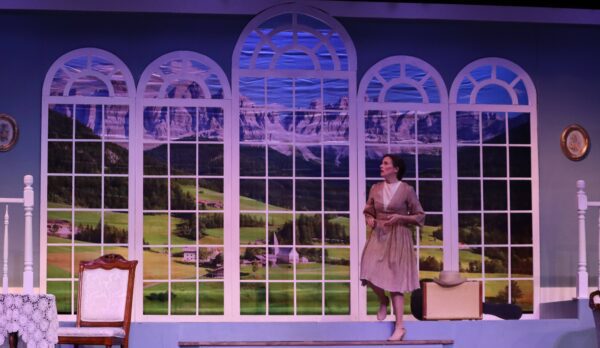 The painted Austrian backdrop -- done by Bill Marsoun -- in the "Sound of Music" set, designed by Kevin Pieper, and Sarah Lounsberry as Maria.
