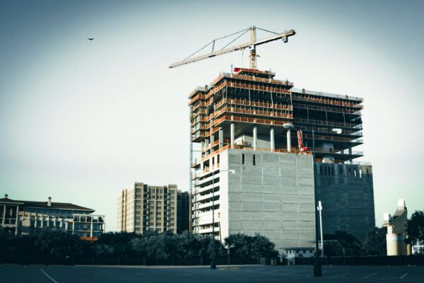 A modern high-rise building under construction in urban area