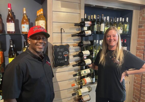 Owners of Pop the Cork are Chris Carr (left) and Tara Rommel. (photo by Jonathan Turner)