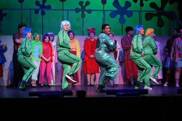 Juniper Garza (center) as Plankton leads "When the Going Gets To\ugh" in the new Music Guild production.