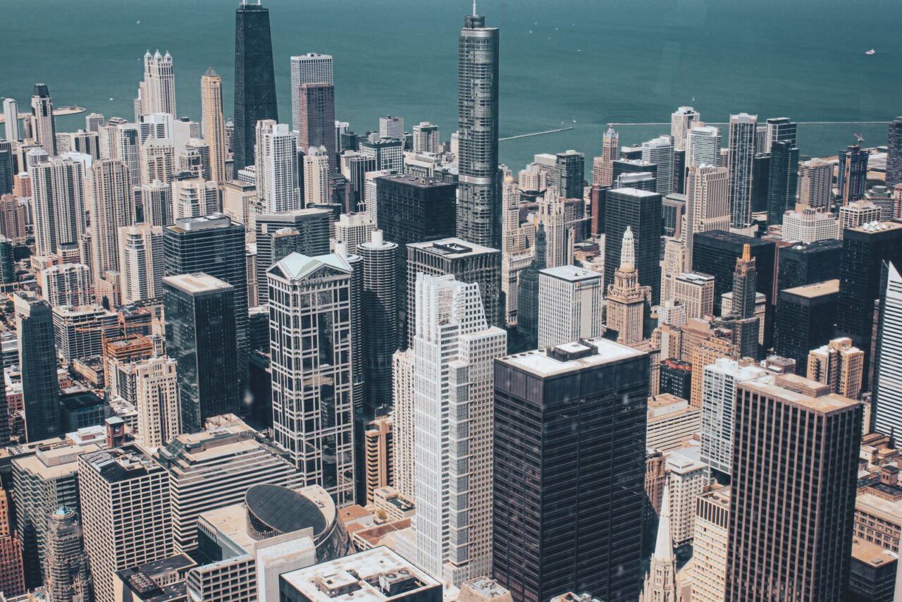 Stunning aerial view of Chicago's skyline showcasing modern skyscrapers against Lake Michigan.