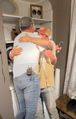 The cutout of Luke Bryan hugging Colin that Lexie made for his 32nd birthday party at their home.