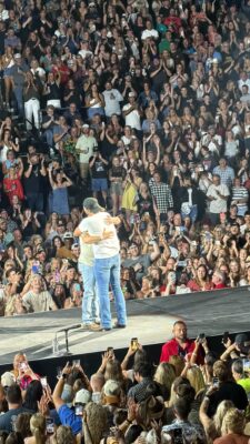 Colin hugs Luke Bryan as the crowd goes wild at Vibrant Arena July 10, 2026.