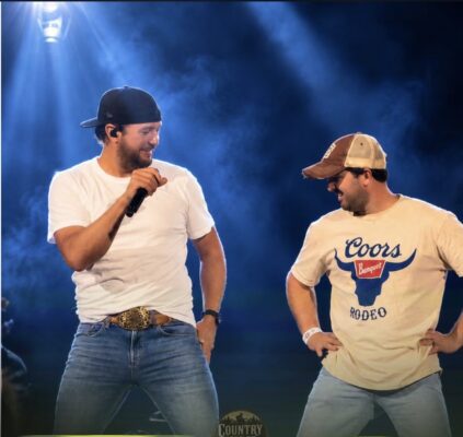 Country star Luke Bryan banters with Colin Gould on stage at the July 10 sold-out show.