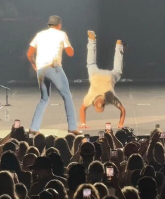 Colin surprised his wife and the sold-out arena crowd by doing the "worm" on stage at Luke Bryan's concert.