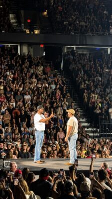 Colin on stage with country star Luke Bryan at the sold-out show July 10, 2026 at Vibrant Arena at The MARK, Moline.