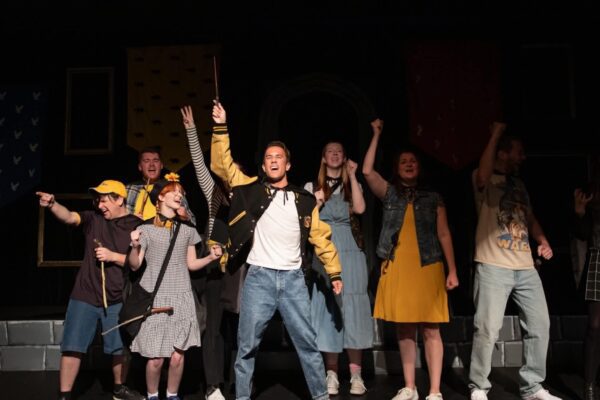 Tommy Ratkiewicz (center) in "Puffs" at The Black Box Theatre (credit: Capturing Fireflies Photography)