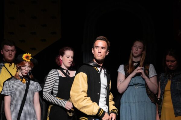 Tommy Ratkiewicz (center) in "Puffs" at The Black Box Theatre (credit: Capturing Fireflies Photography)