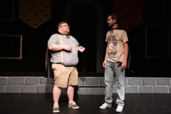 Vea Vavrosky (left) as Oliver and Aaron Deneckere as Wayne in "Puffs" at Black Box Theatre. (credit: Capturing Fireflies Photography)