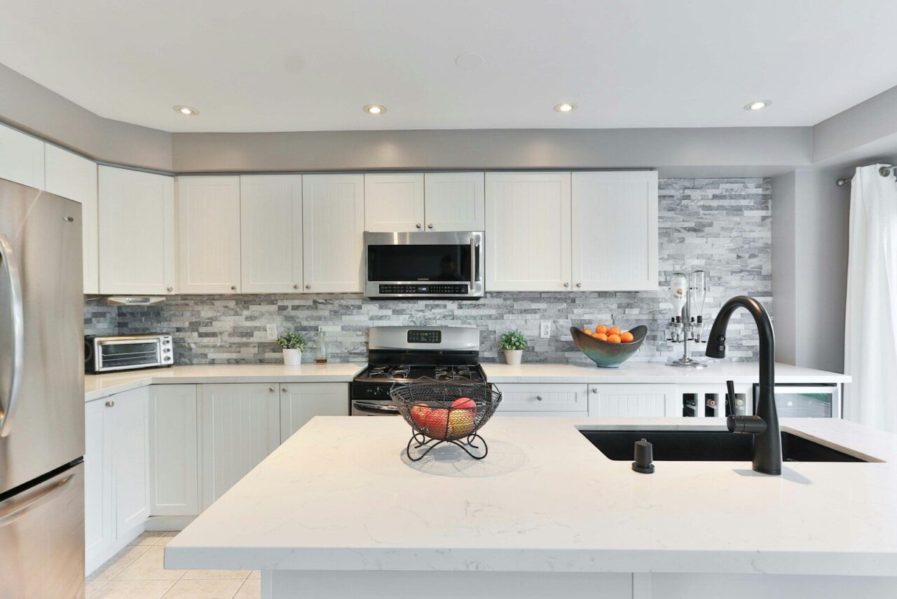 Modern kitchen with stainless steel sink and faucet