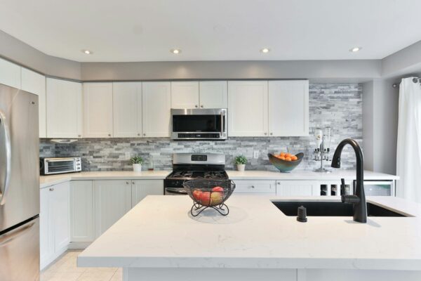 Modern kitchen with stainless steel sink and faucet